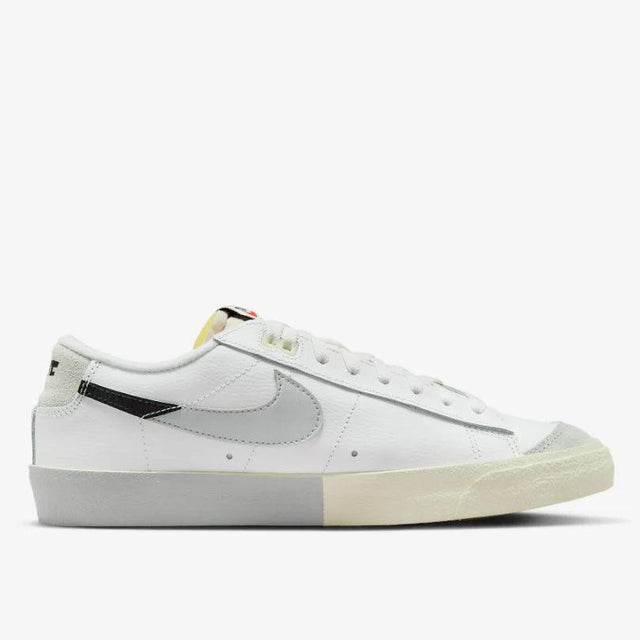 Shop Nike Blazer Low ’77 Split Sneakers in White, Black, and Grey. Featuring a leather & suede build with signature padded tongues and a unique “Split” design.