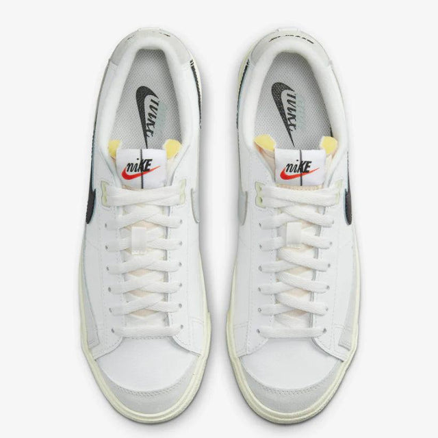 Shop Nike Blazer Low ’77 Split Sneakers in White, Black, and Grey. Featuring a leather & suede build with signature padded tongues and a unique “Split” design.