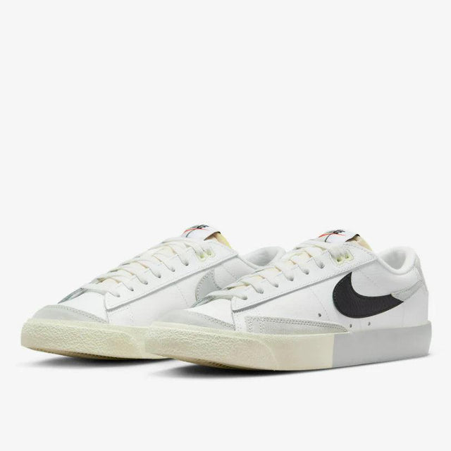 Shop Nike Blazer Low ’77 Split Sneakers in White, Black, and Grey. Featuring a leather & suede build with signature padded tongues and a unique “Split” design.