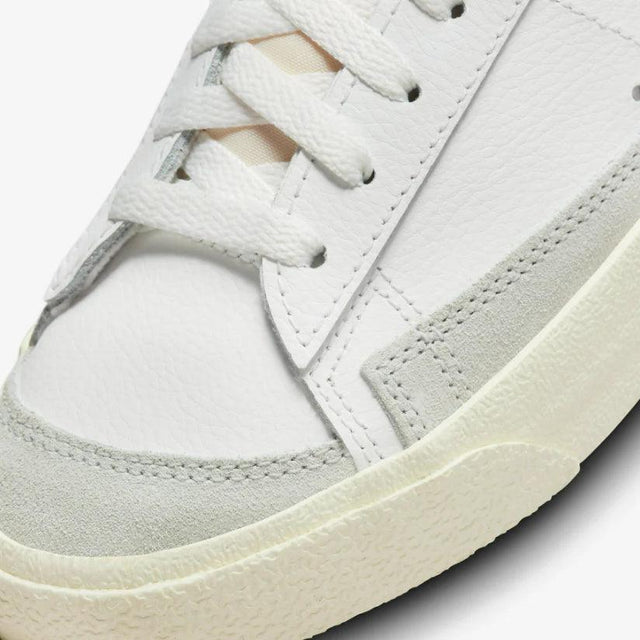 Shop Nike Blazer Low ’77 Split Sneakers in White, Black, and Grey. Featuring a leather & suede build with signature padded tongues and a unique “Split” design.