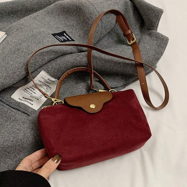 Retro Nylon Dumpling Bag - Attribute Details Style Fashionable Features Lightweight Color Burgundy Magnetic No Bag Size Mini Closure Type Zipper Strap Type Top Handle Details Buckle, Spiked Pattern Type Colorblock, Colorful Type Square Bag Coating 100% Po