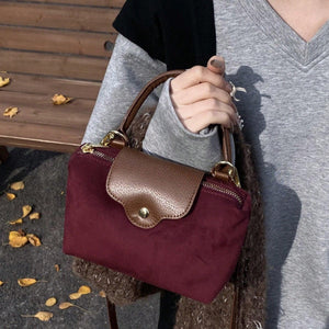 Retro Nylon Dumpling Bag - Attribute Details Style Fashionable Features Lightweight Color Burgundy Magnetic No Bag Size Mini Closure Type Zipper Strap Type Top Handle Details Buckle, Spiked Pattern Type Colorblock, Colorful Type Square Bag Coating 100% Po