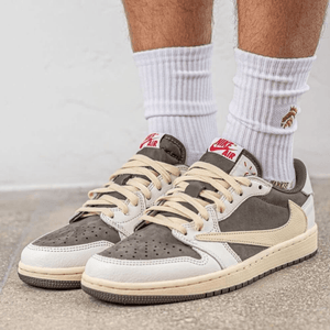 Get the Travis Scott x Air Jordan 1 Low OG 'Reverse Mocha' in Nepal! Featuring premium brown suede, reverse Swoosh, scarlet accents, and vintage-inspired details. Limited edition—shop now!